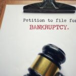 Petition to file for bankruptcy with court gavel representing Florida bankruptcy law