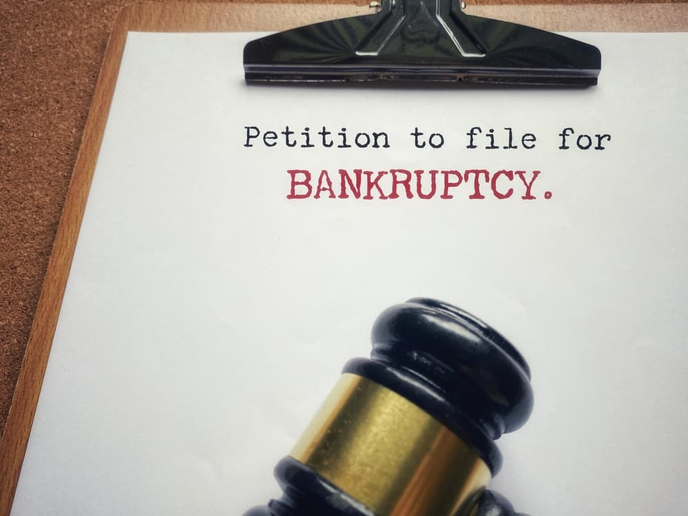 Petition to file for bankruptcy with court gavel representing Florida bankruptcy law