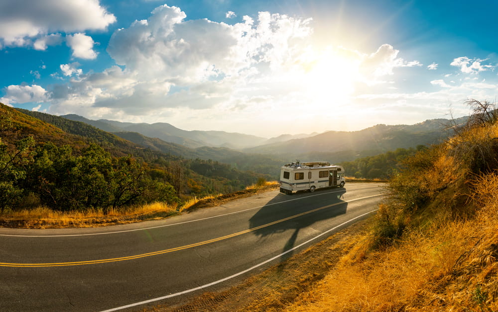 Recreational vehicle driving on open road representing RV bankruptcy exemptions and asset protection in Florida